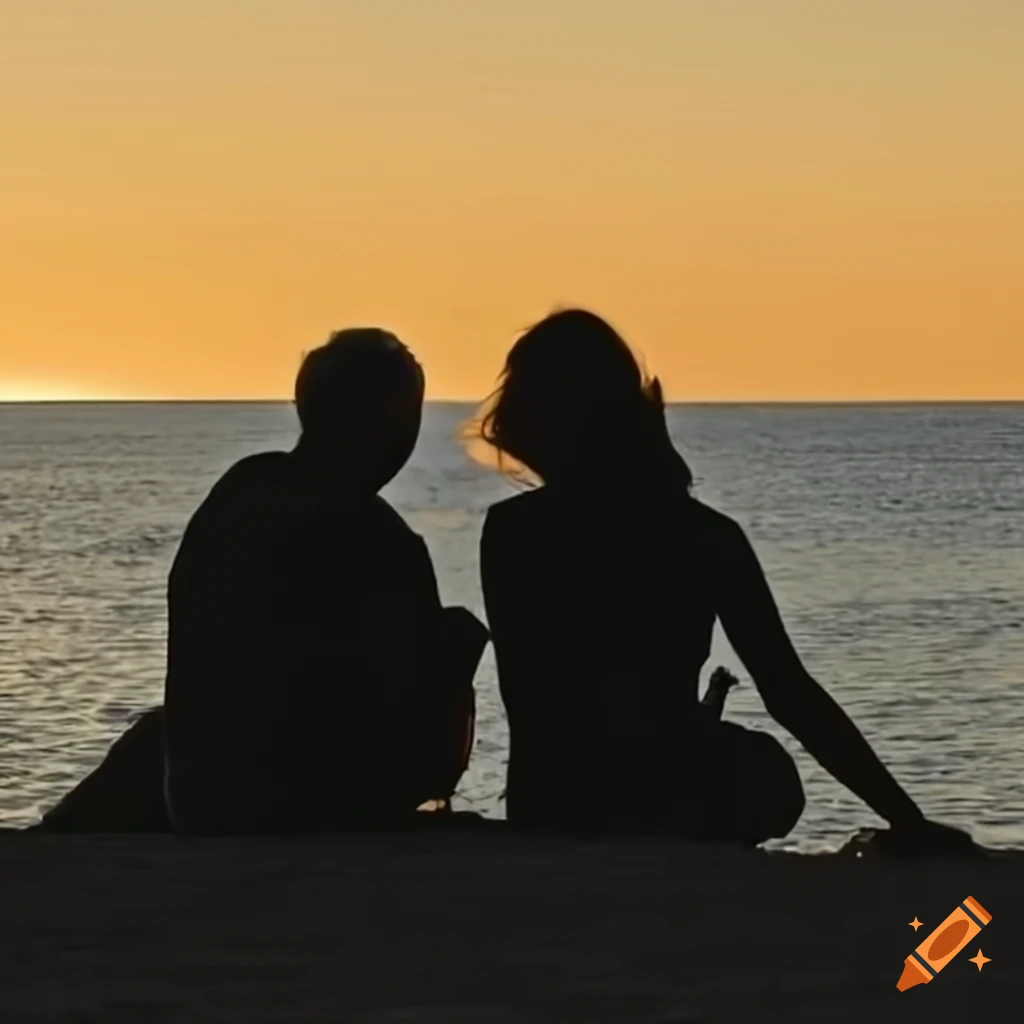 silhouette of a man sitting by the sea