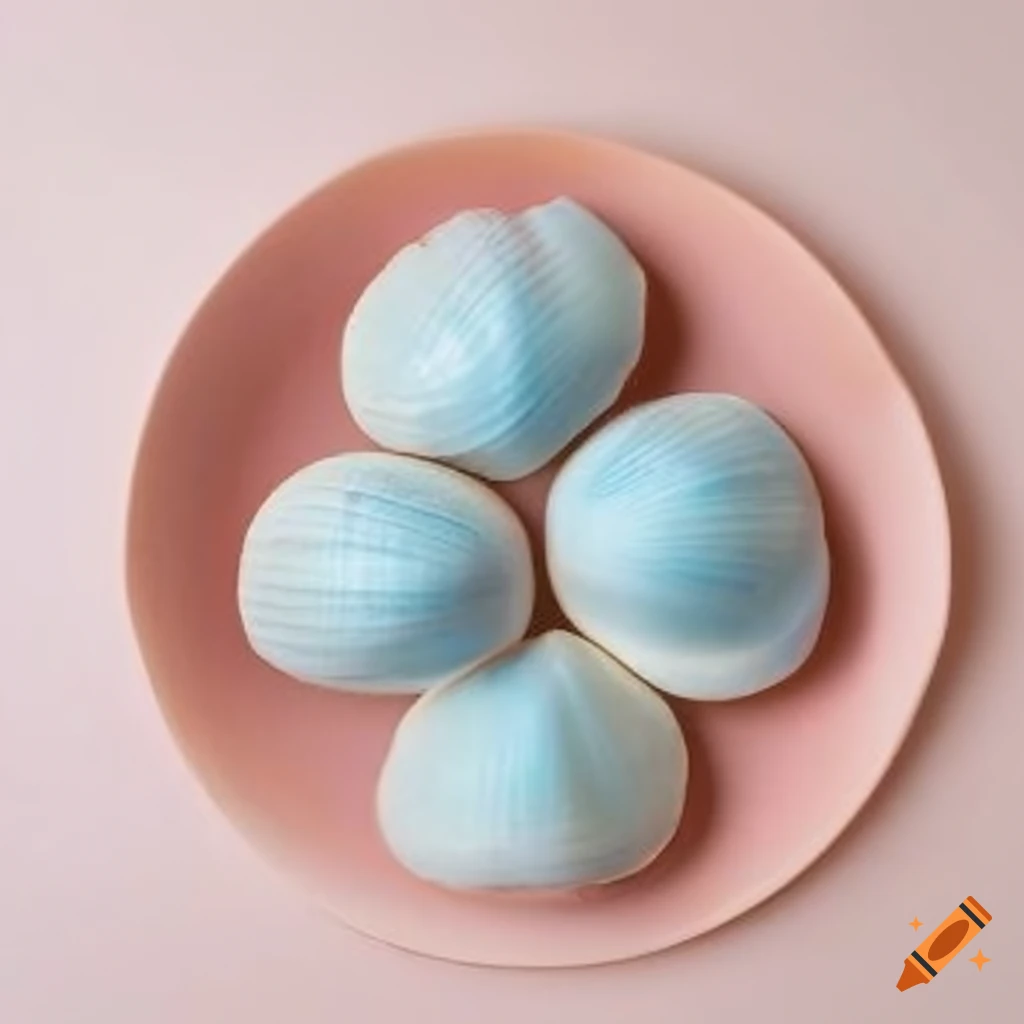 arrangement of light blue sand dollars on a pink seashell plate