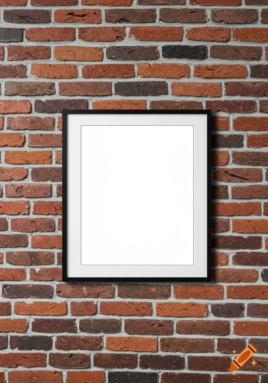 A black frame with a white mat and empty center hanging on a brick wall.