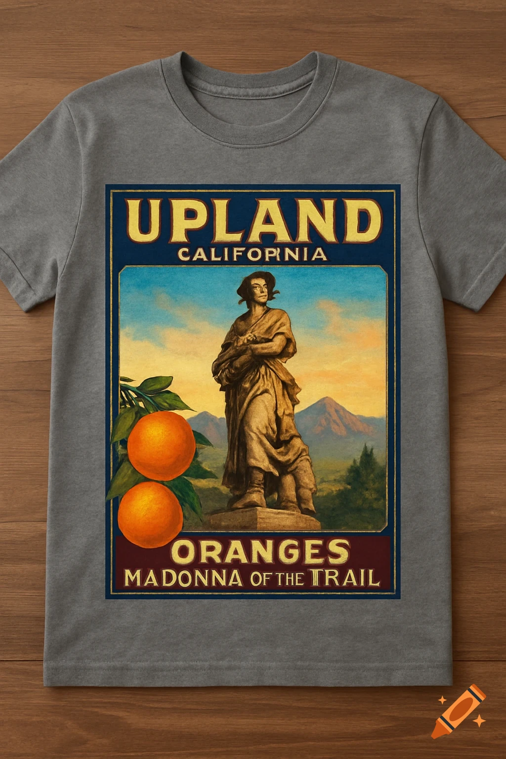 Gray t-shirt with vintage orange crate label illustration featuring a statue, oranges, and text