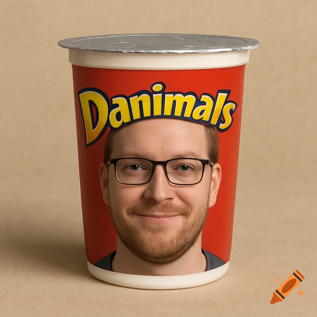 Smiling man's face on a red Danimals yogurt cup.