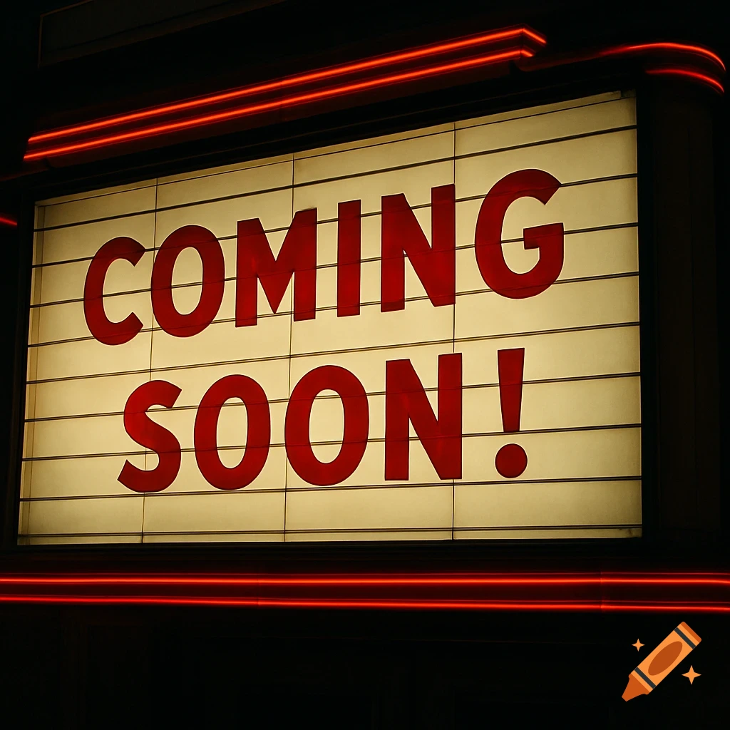 A movie marquee sign lit at night displaying the words 'COMING SOON!'