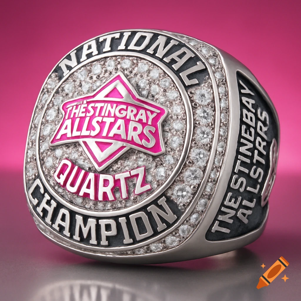 A large, silver national champion competition cheerleading ring with a pink top featuring a star logo and many small diamonds.