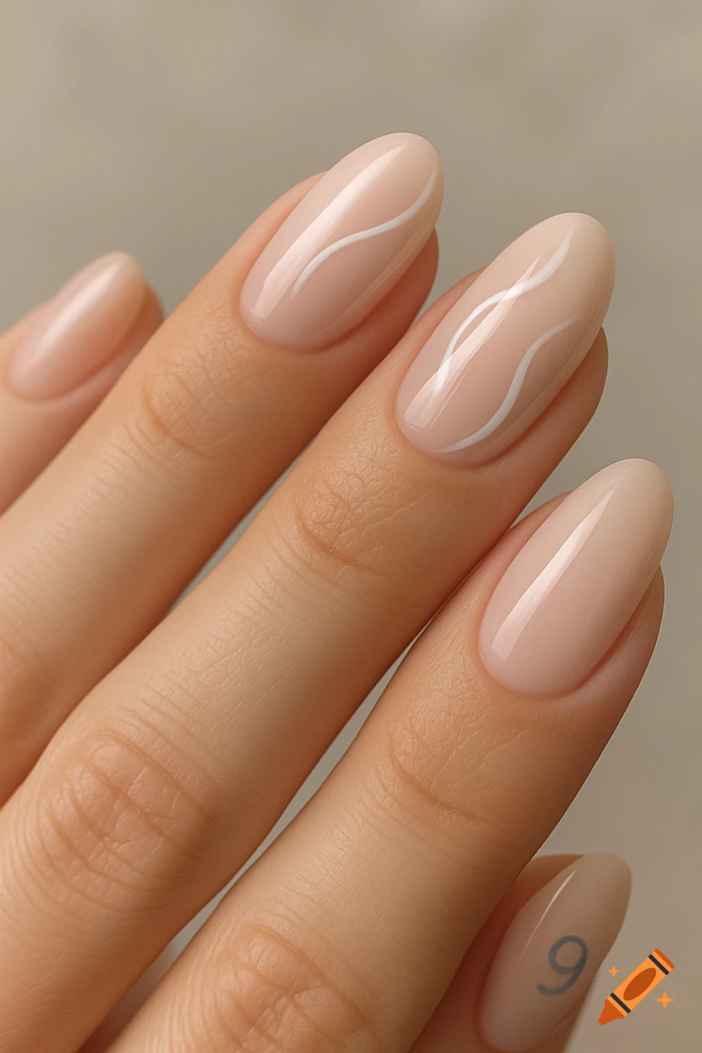 Close-up of a hand with nude-colored oval nails. Two nails have white wavy lines, and the pinky nail has a soft blue number 9.