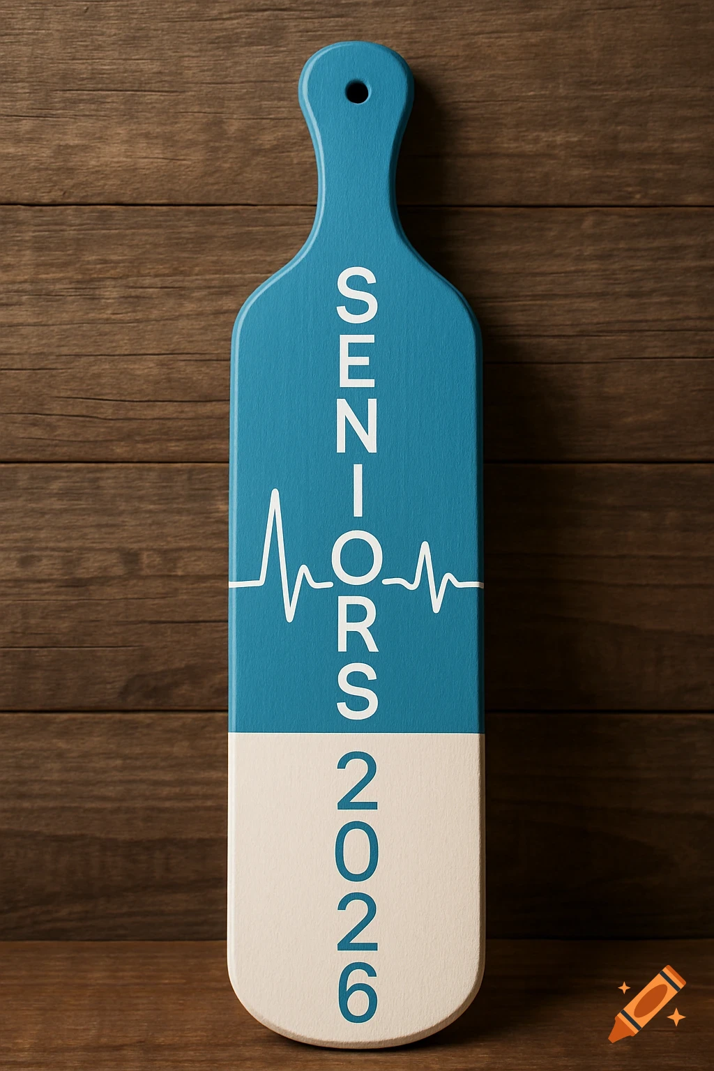 A blue and white wooden paddle with 'SENIORS' and '2026' text and an EKG line, set against a wooden background.