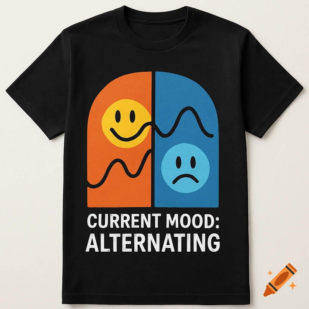 Black t-shirt with a graphic featuring a happy face on orange and a sad face on blue, split by a wavy line. Text says 'CURRENT MOOD: ALTERNATING'.