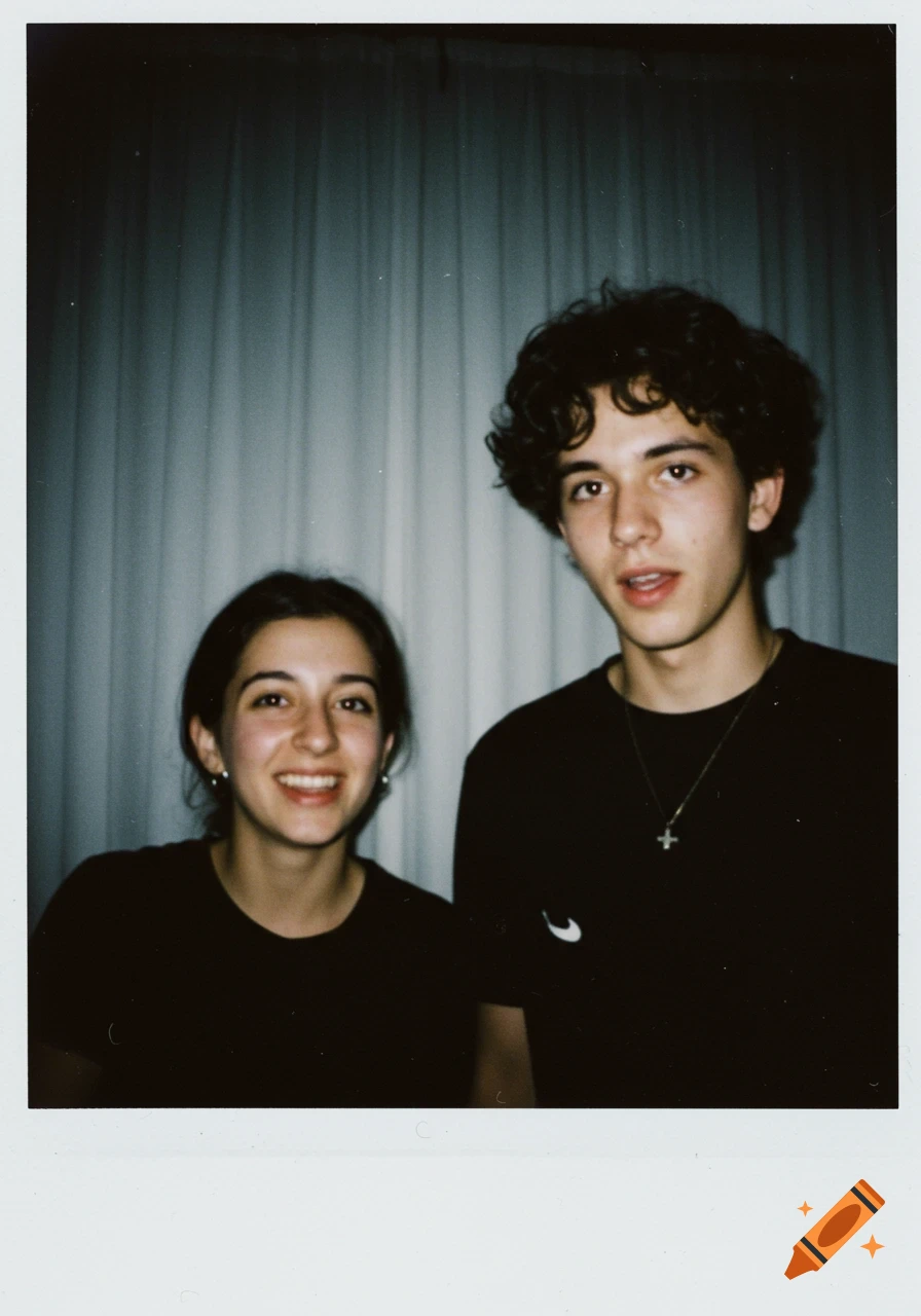 A young woman smiling next to a young man with curly hair, both in black shirts, captured in a grainy Polaroid style.