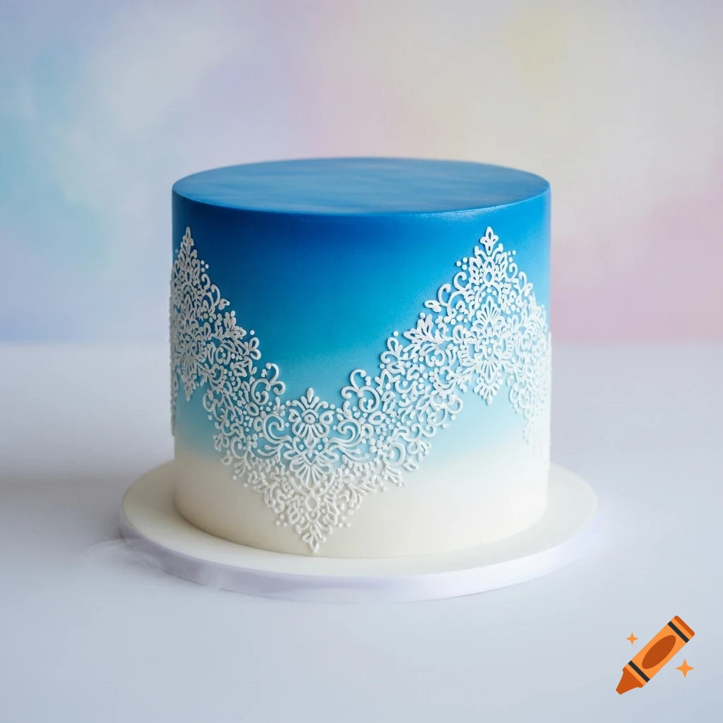 A round cake with an ombré blue to white design, intricately decorated with white floral piping.