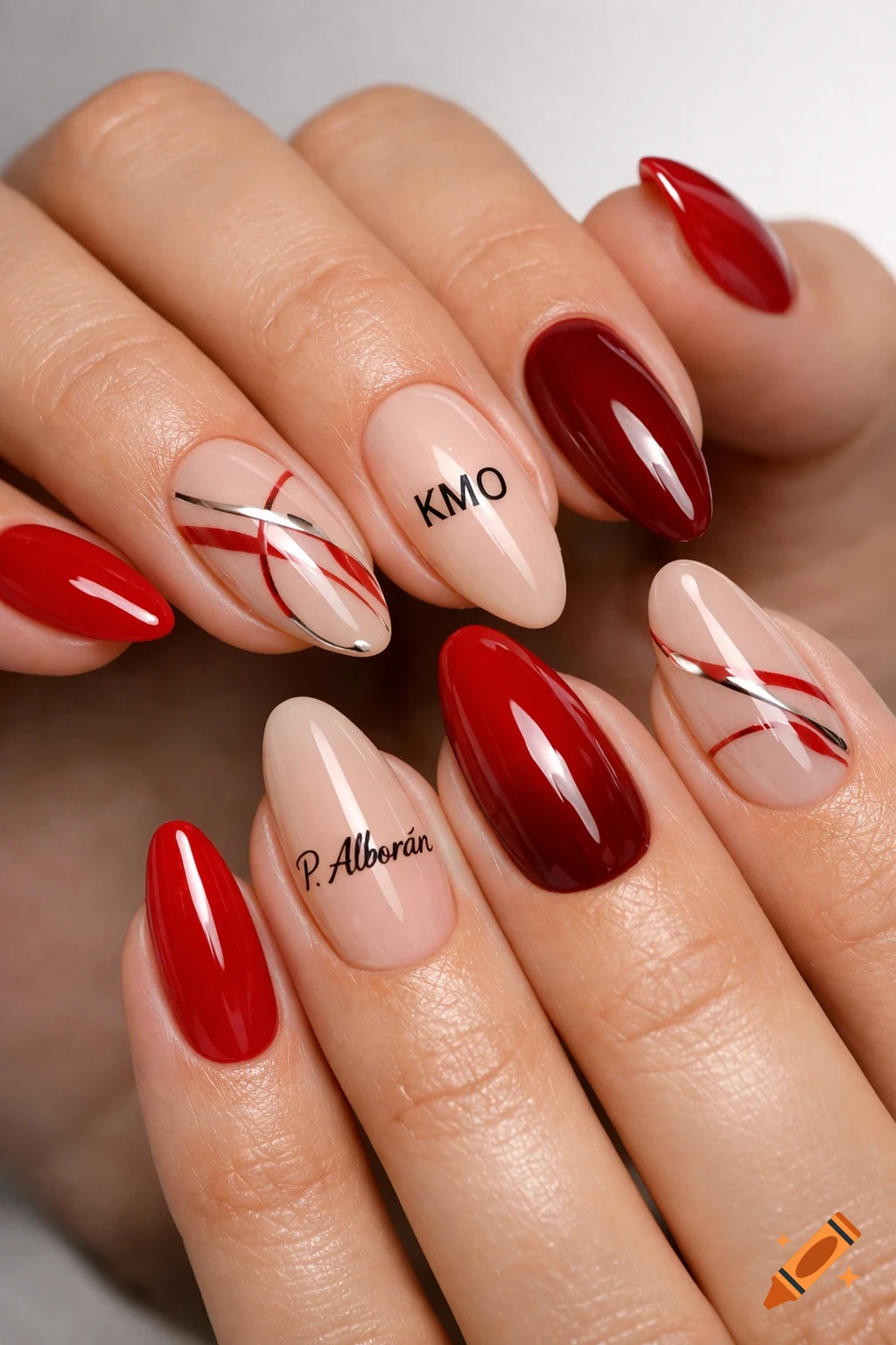 Female hands with red, wine red, and nude almond-shaped acrylic nails, some with red/silver lines and text 'KMO', 'P. Alborán'.