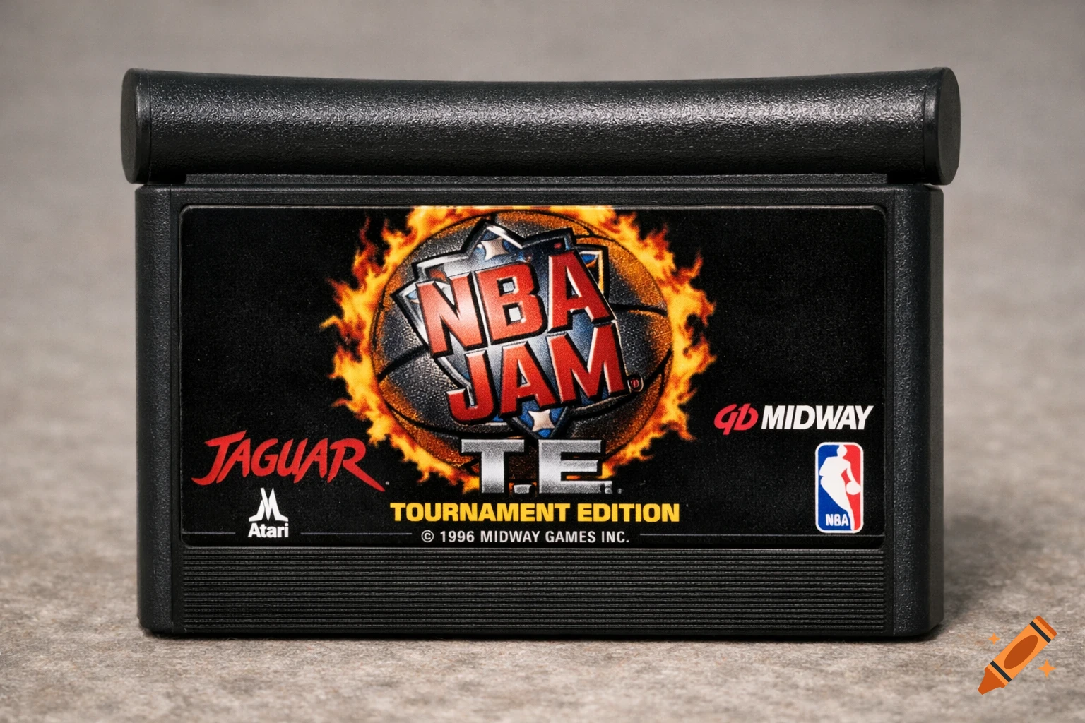 A black Atari Jaguar video game cartridge with the "NBA Jam: Tournament Edition" label, featuring a basketball engulfed in flames.