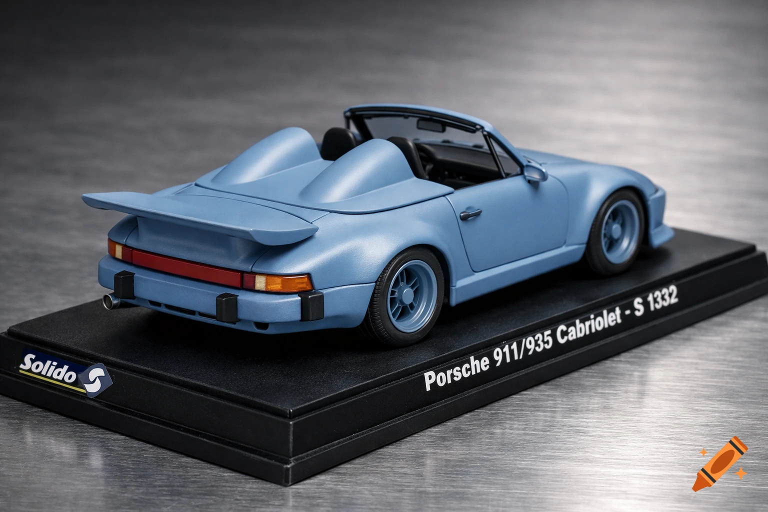A light blue matte Porsche 911/935 convertible model car with a double-humped tonneau cover, displayed on a black Solido base.