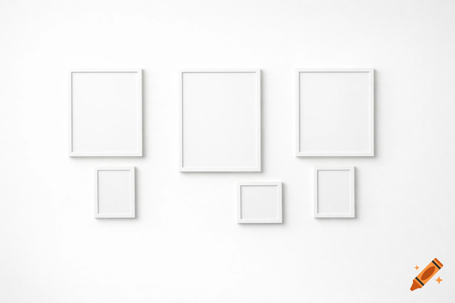 Six white blank picture frames of varying sizes arranged on a minimalist white wall, casting soft shadows.