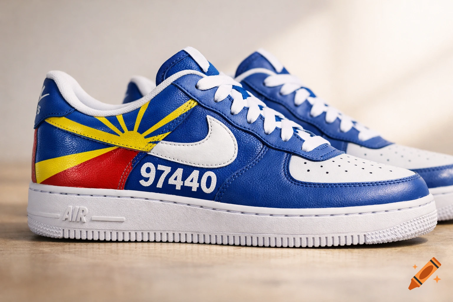 Custom blue and white Nike Air Force 1 sneakers with Reunion Island flag design and '97440' text, on wood.