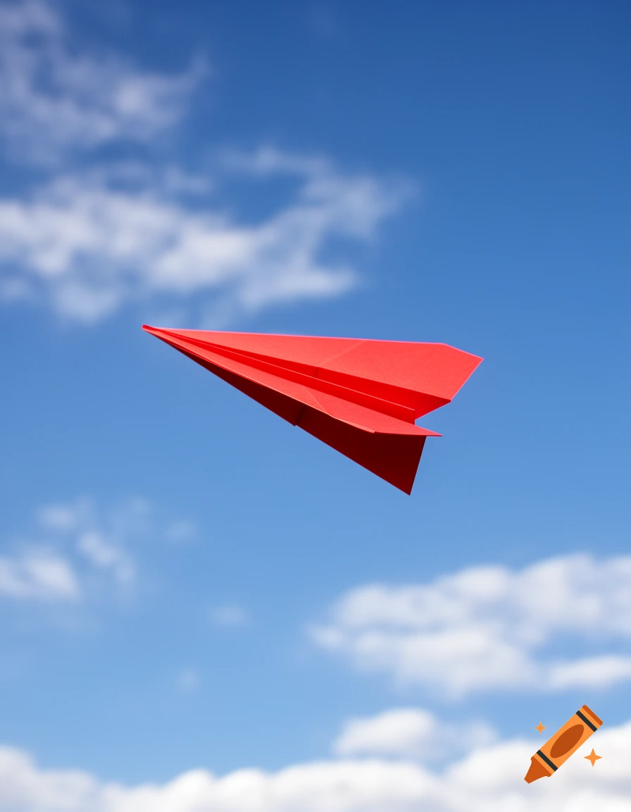 A vibrant red paper airplane soars against a clear blue sky with fluffy white clouds.