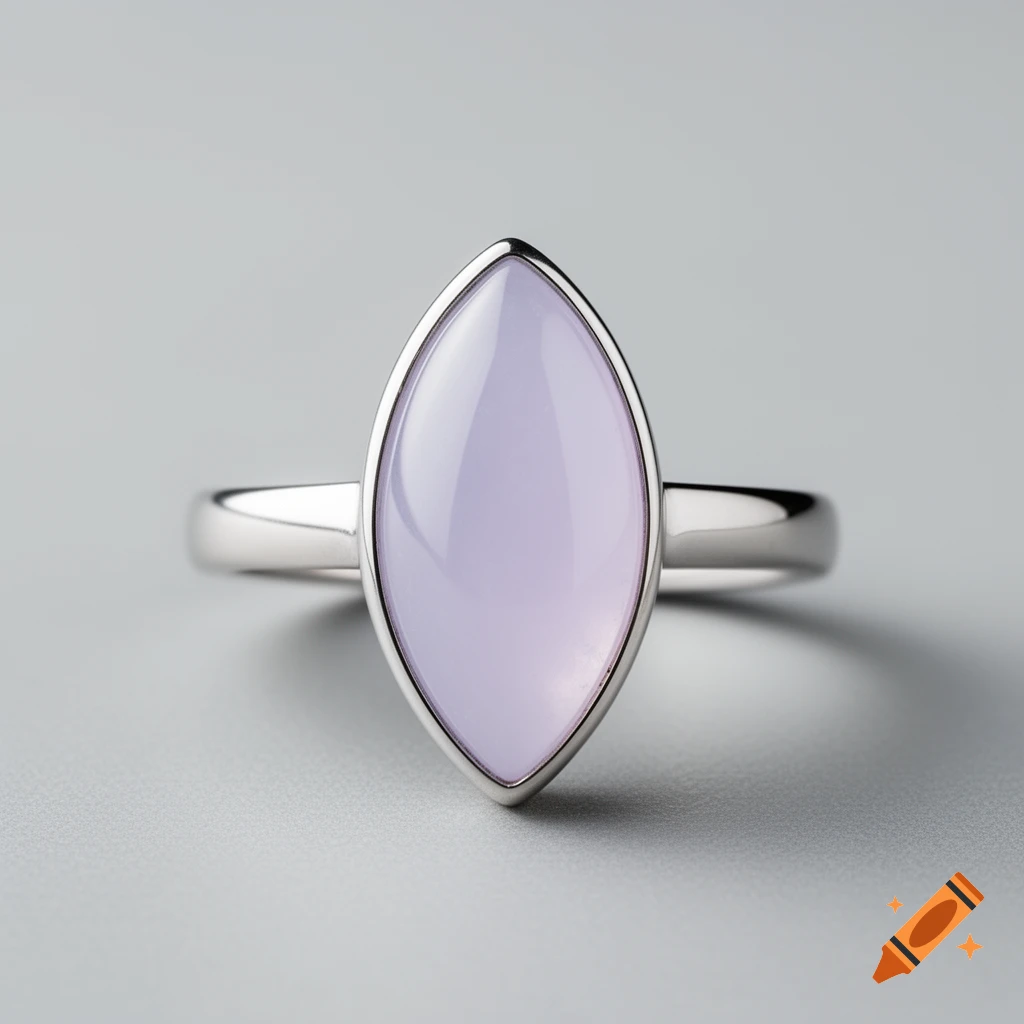 A silver ring featuring a marquise-shaped, pale lavender-purple cabochon gemstone, against a smooth grey background.