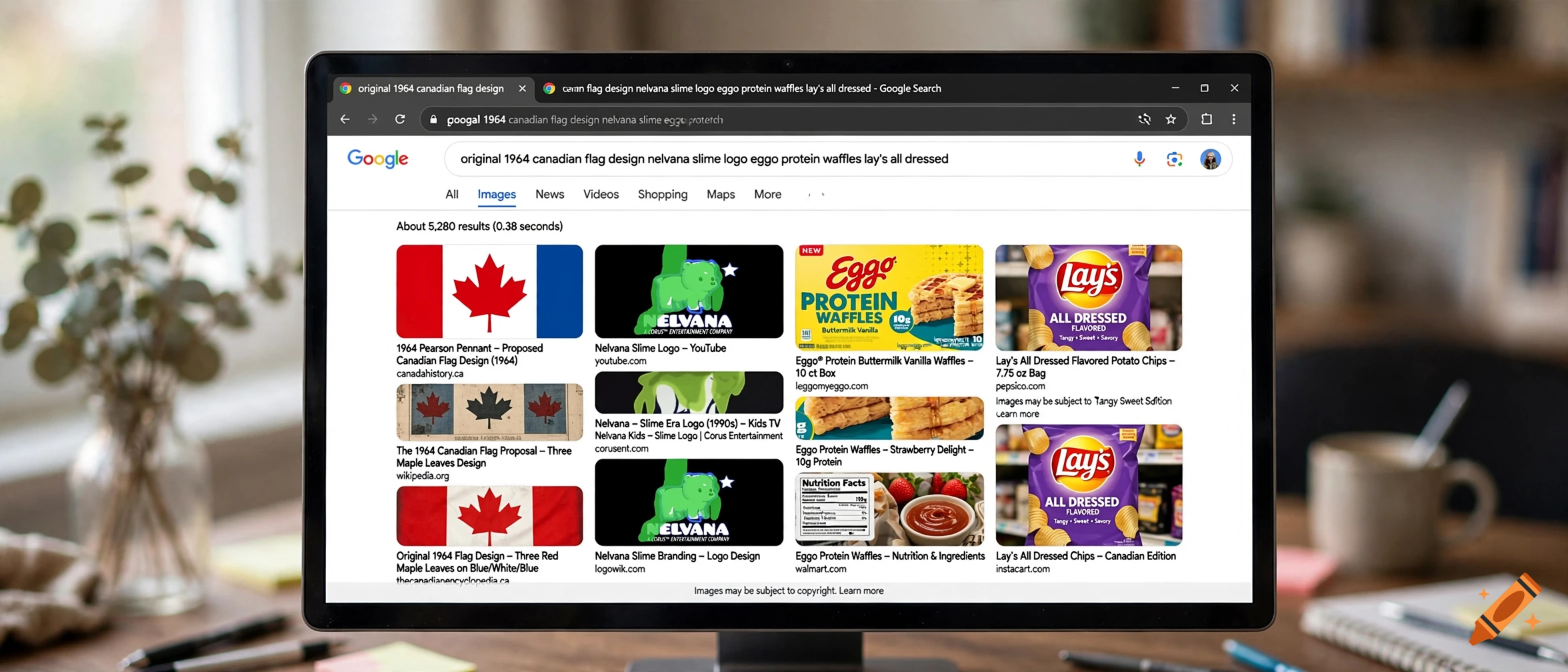 Close-up of a computer monitor displaying a Google image search for historical Canadian flags, cartoons, waffles, and chips.