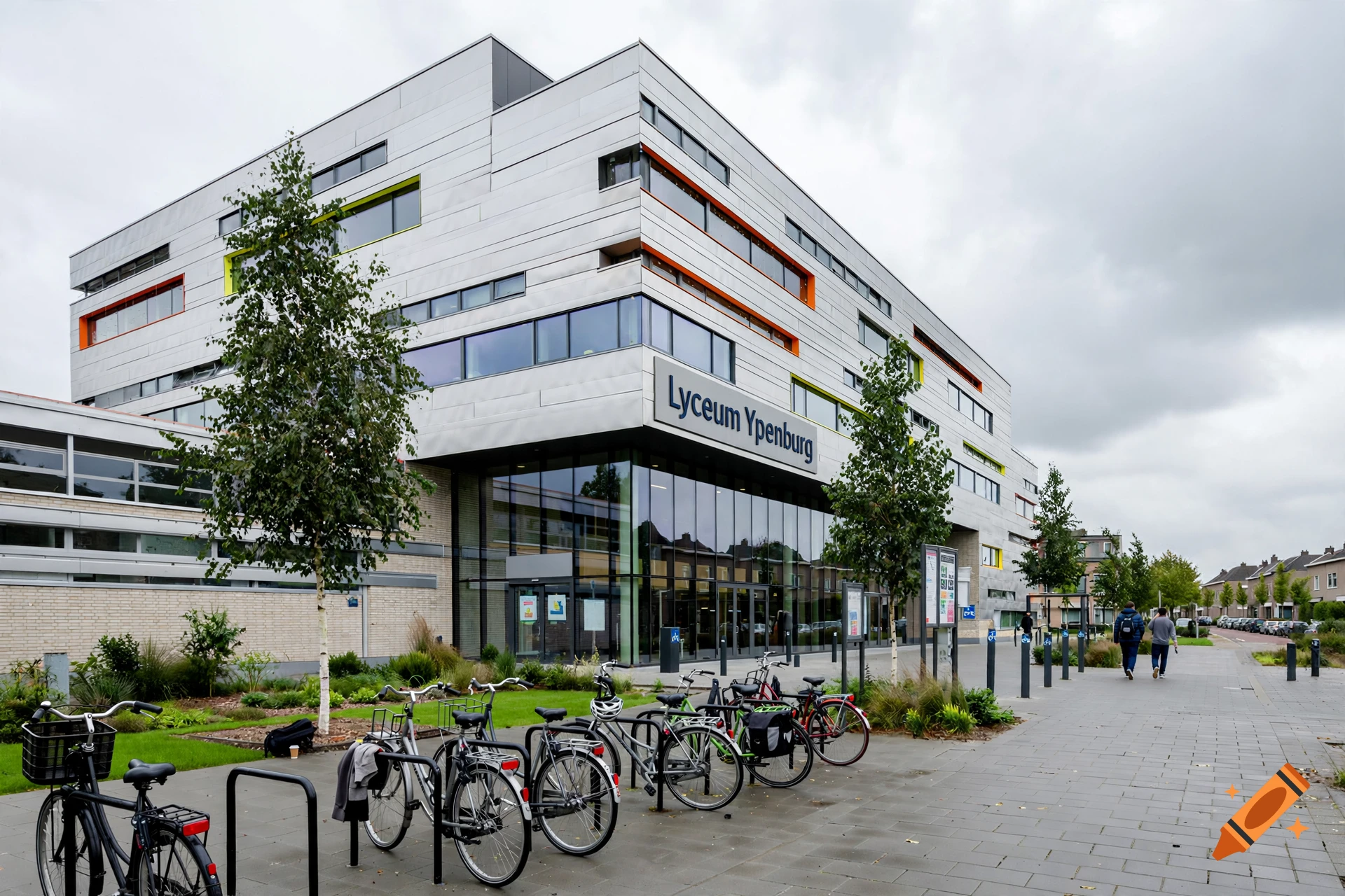Exterior view of the modern Lyceum Ypenburg building with large glass windows, bicycle racks in front, and a cloudy sky.