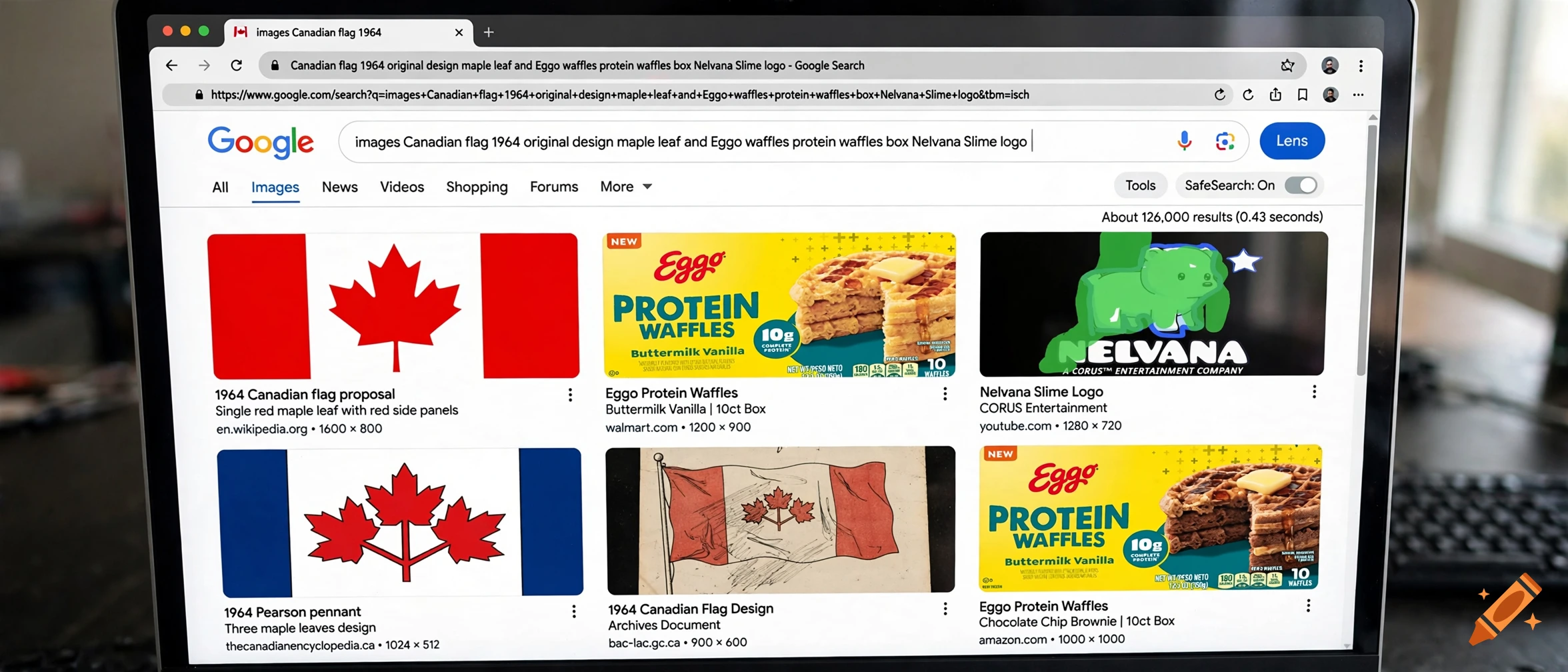 A laptop screen showing a Google image search results page for Canadian flag designs and product boxes.