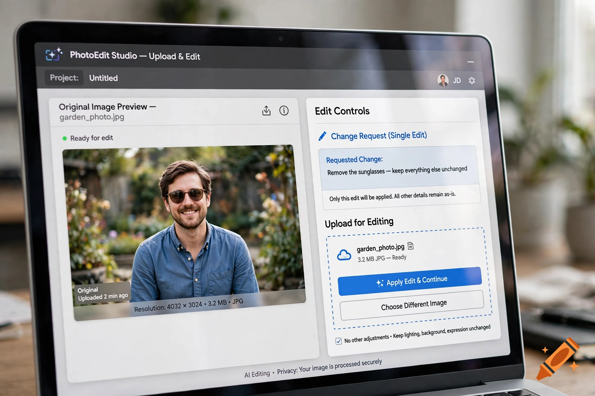 Close-up of a laptop screen displaying a photo editing software interface with a man's portrait.