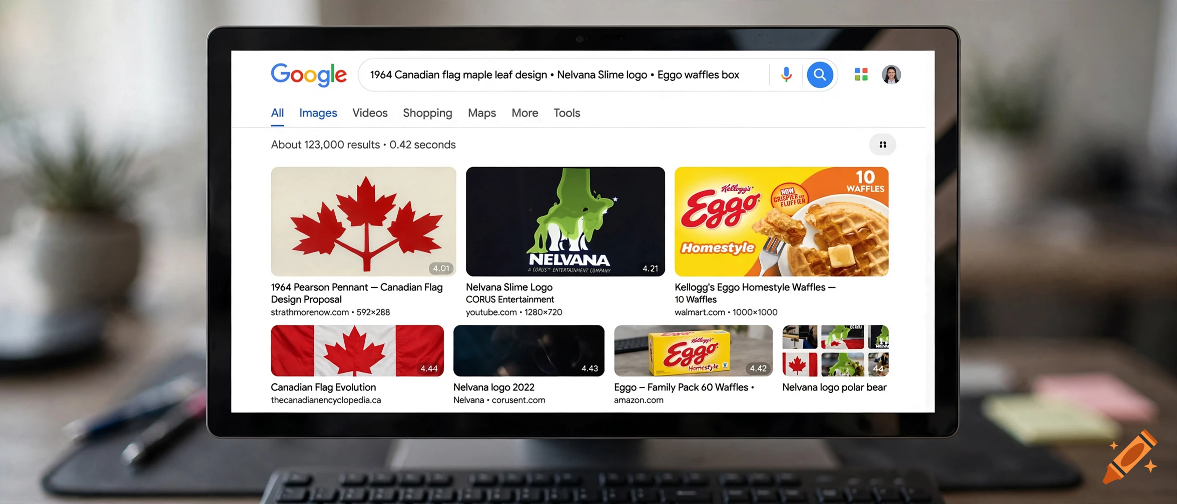 A computer monitor displaying a Google search results page with image thumbnails of various logos, flags, and food packages.
